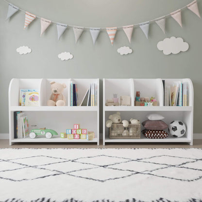 Children's room with white bookshelves filled with books, toys, and decorative items, featuring a banner and cloud decorations on the wall.