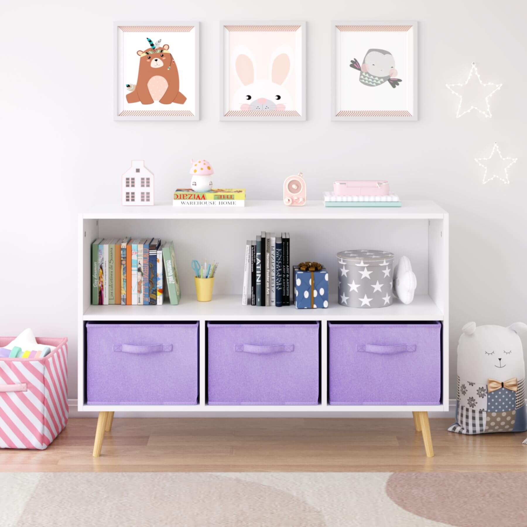 Children's room with a white bookshelf, purple storage bins, and decorative items.