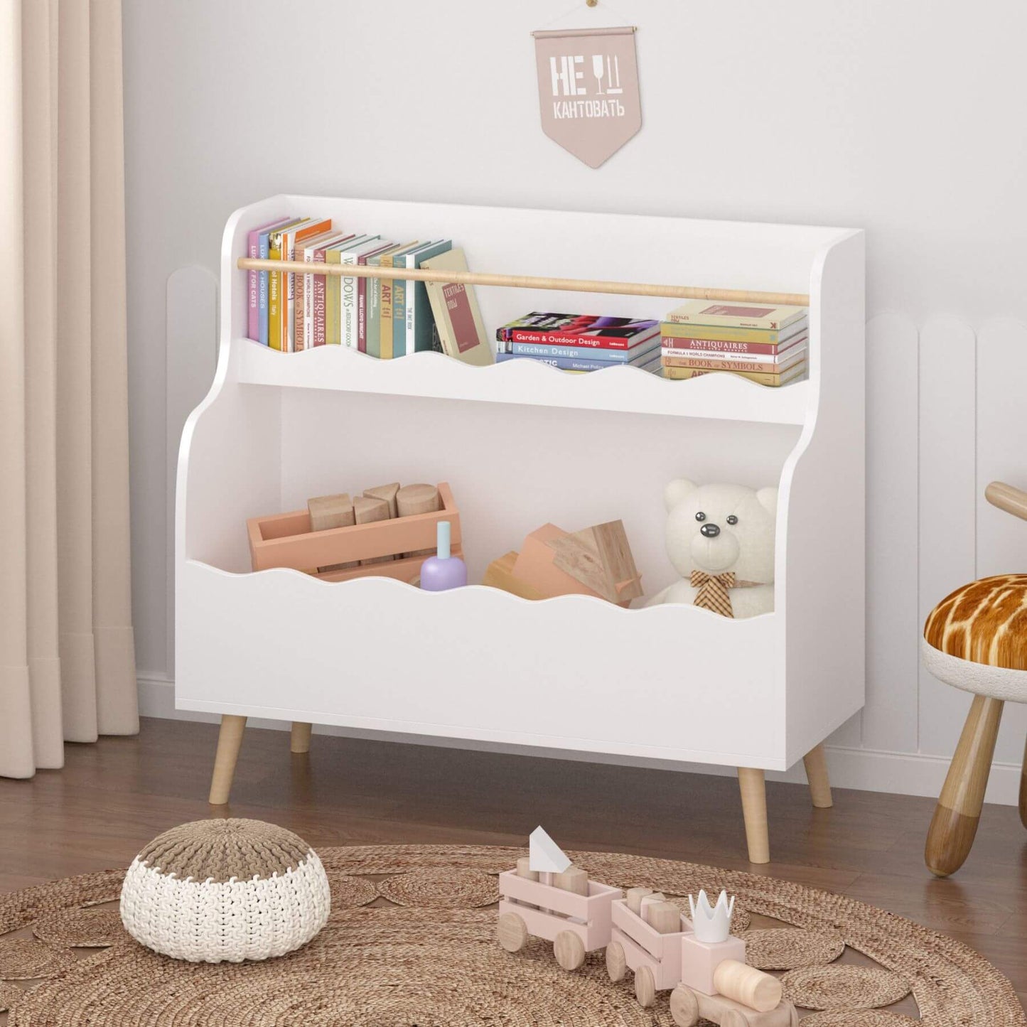 White children's bookshelf with toys and books in a room setting.