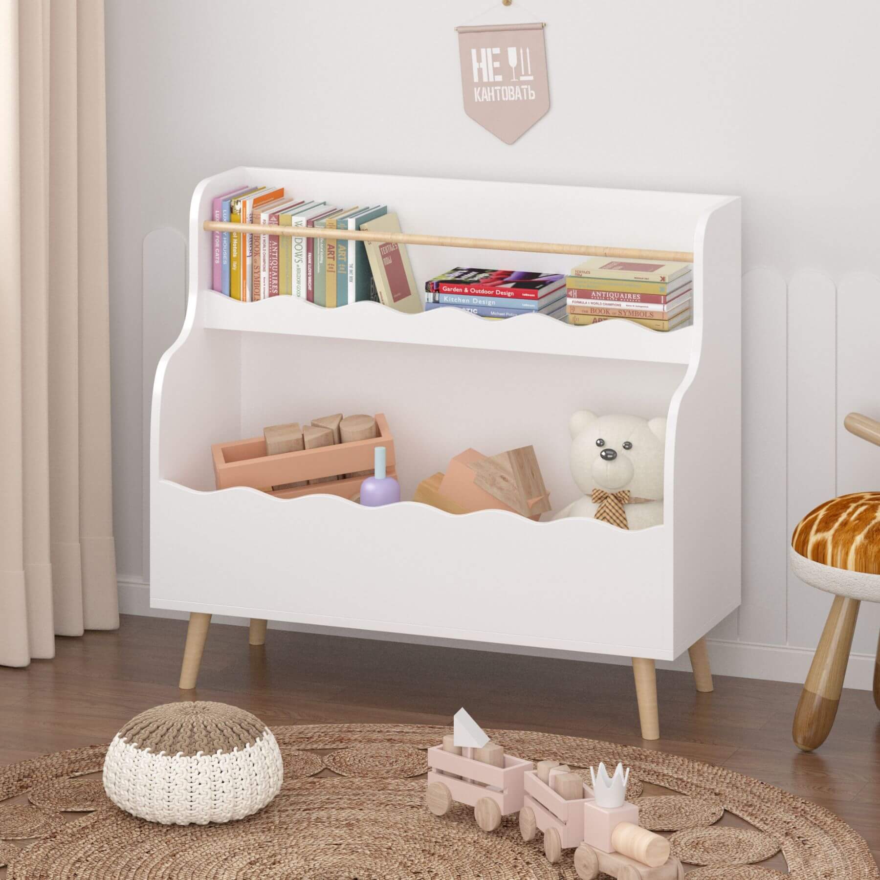 White children's bookshelf with toys and books in a room setting.