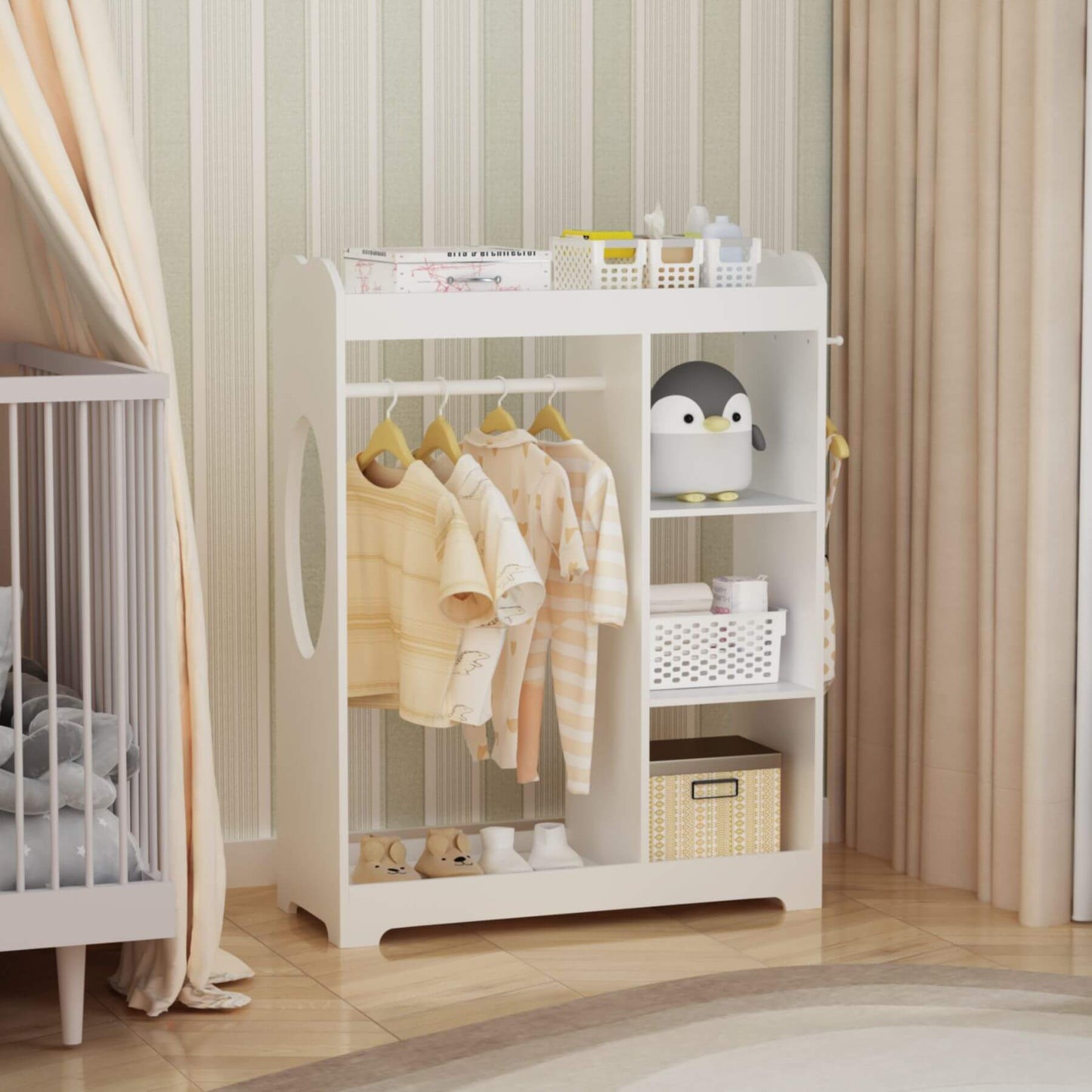 White baby changing table with clothes and toys in a nursery setting
