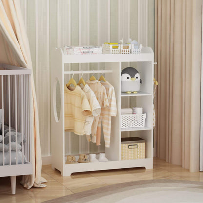 White baby changing table with clothes and toys in a nursery setting