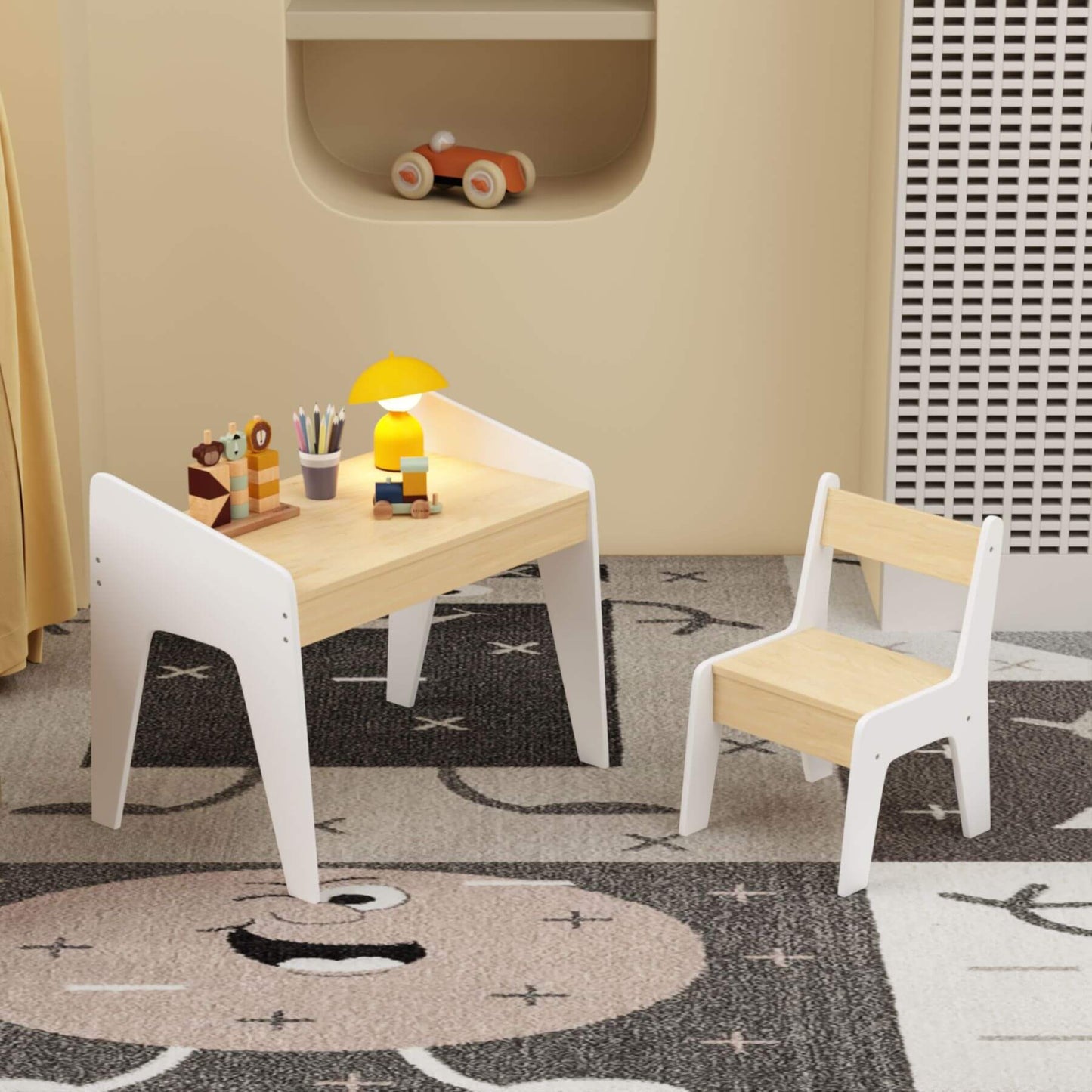 Children's table and chairs set with toys on a patterned rug