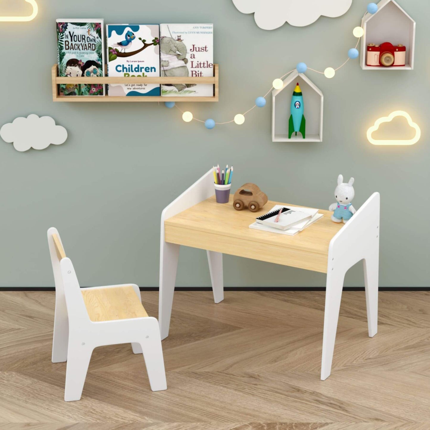 Children's table and chairs set in a room with books and toys on the wall.