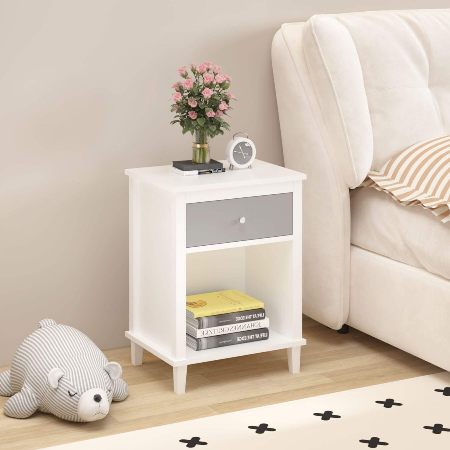MOONRIVER Wooden Nightstand with One Drawer - White+Gray next to a beige sofa, featuring books, a vase with flowers, and a clock.