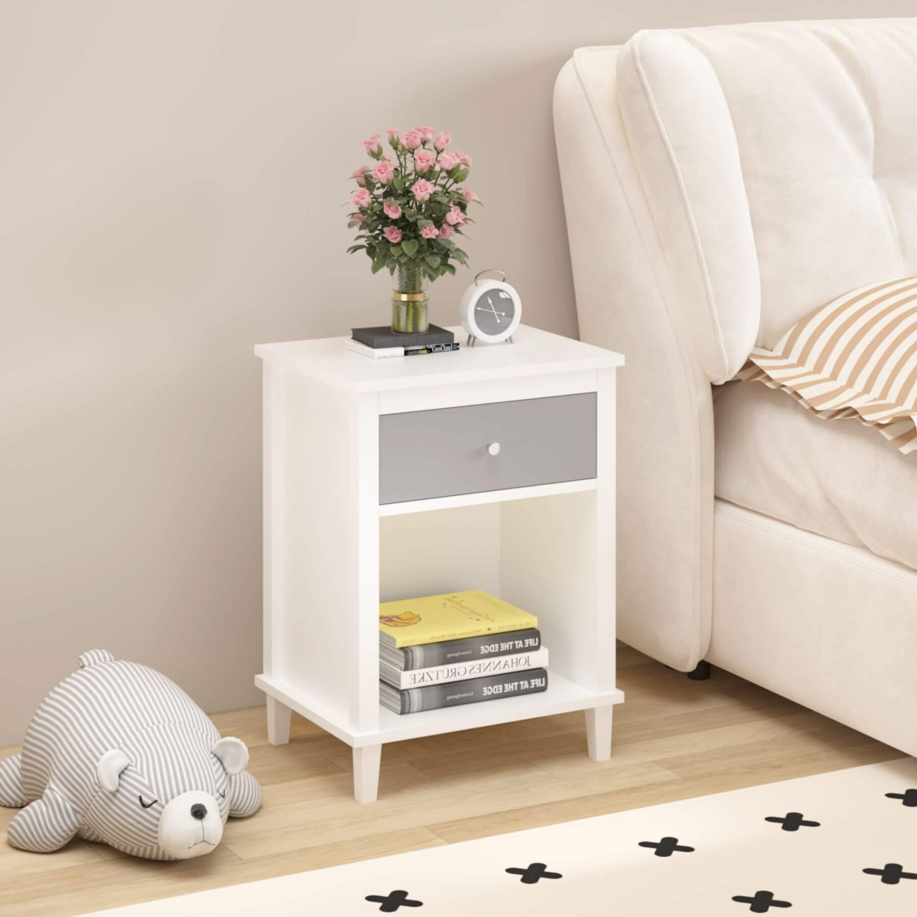 MOONRIVER Wooden Nightstand with One Drawer - White+Gray next to a beige sofa, featuring books, a vase with flowers, and a clock.