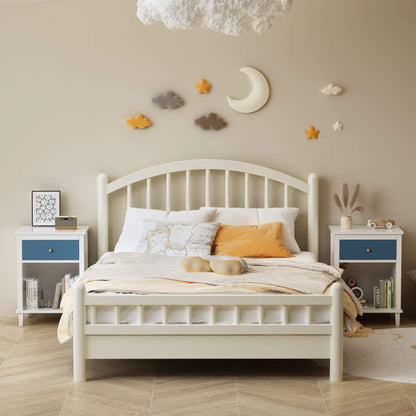 Children's bedroom with a white bed, nightstands, and decorative wall elements.