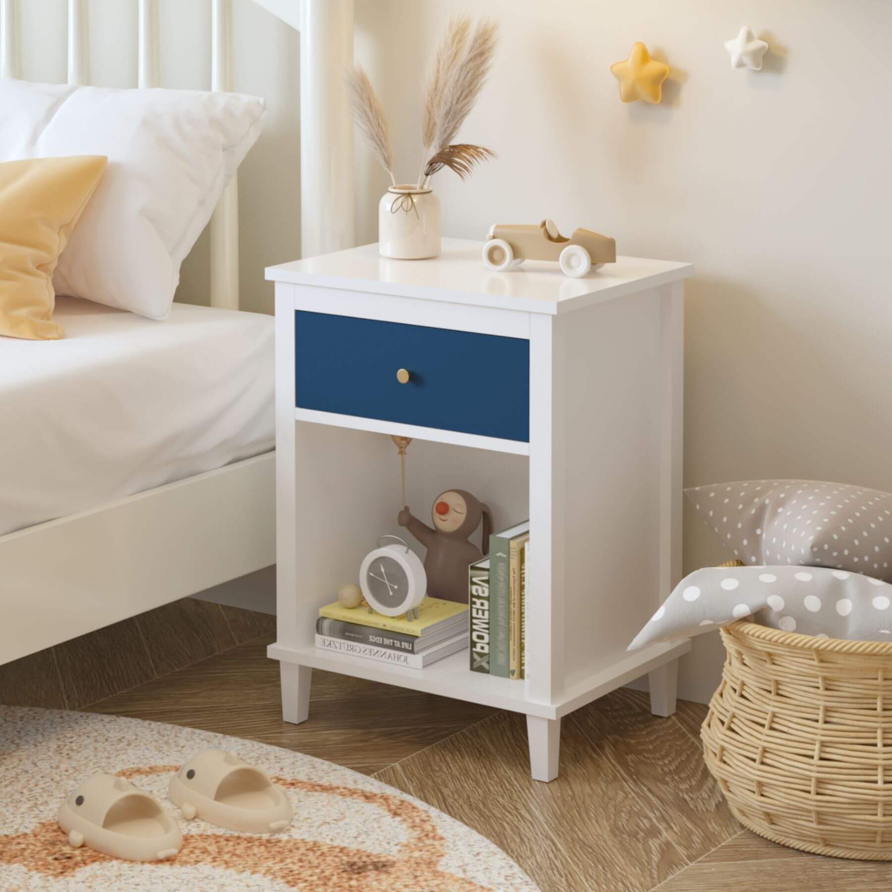 MOONRIVER Golden Handle Wooden Nightstand - White & Navy next to a bed in a bedroom setting.