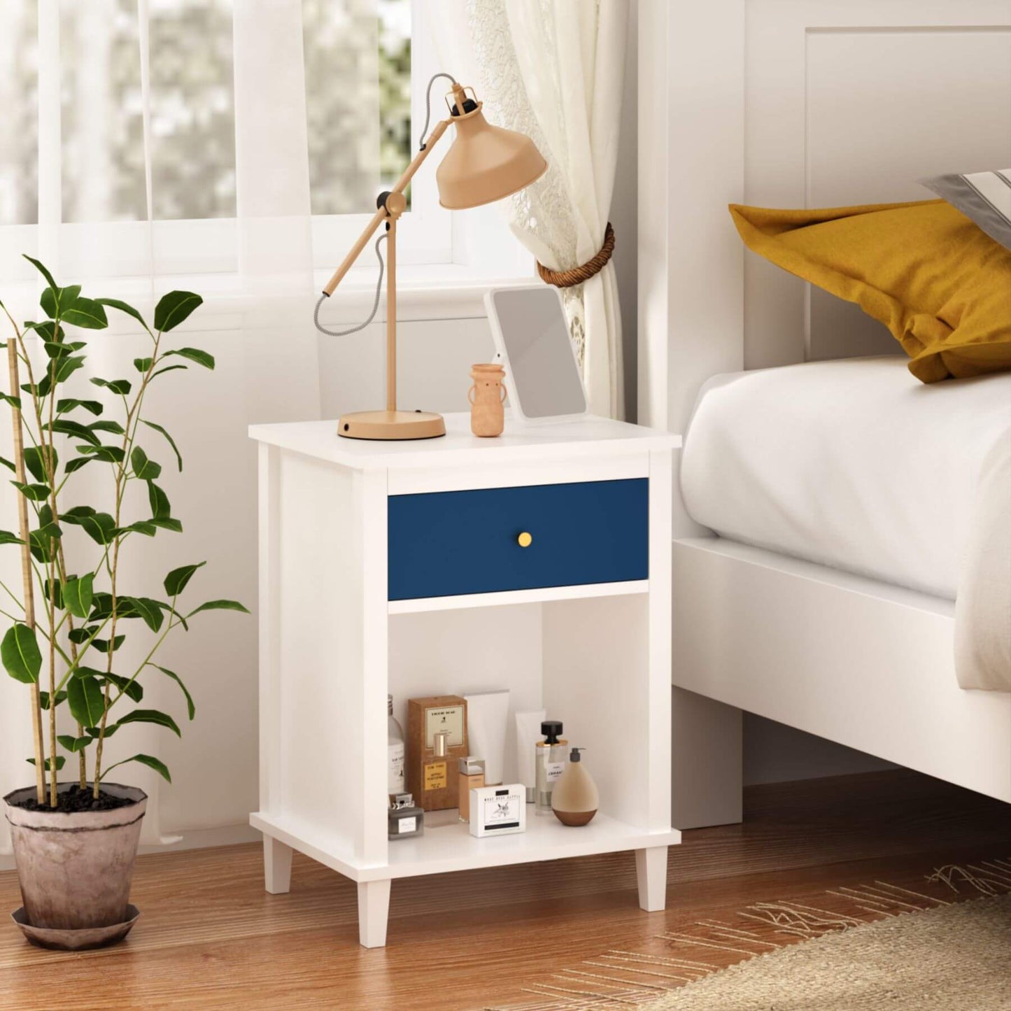 MOONRIVER Golden Handle Wooden Nightstand - White & Navy next to a bed in a bedroom setting