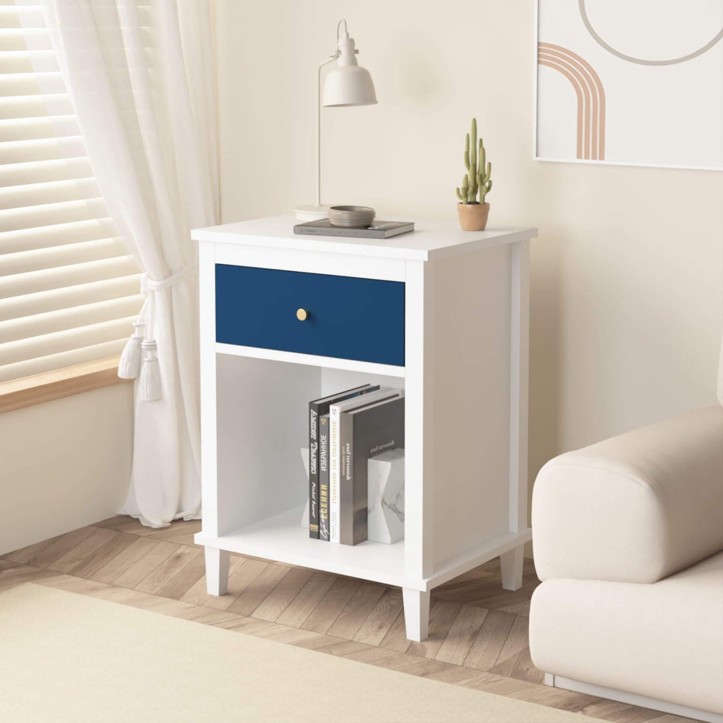 MOONRIVER Golden Handle Wooden Nightstand - White & Navy in a room with a lamp and books.