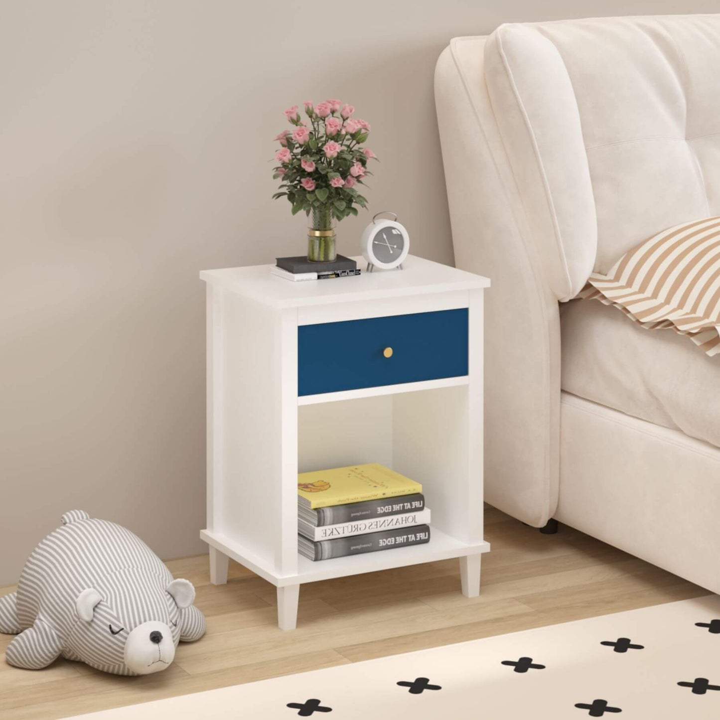 MOONRIVER Golden Handle Wooden Nightstand - White & Navy next to a beige sofa in a living room.
