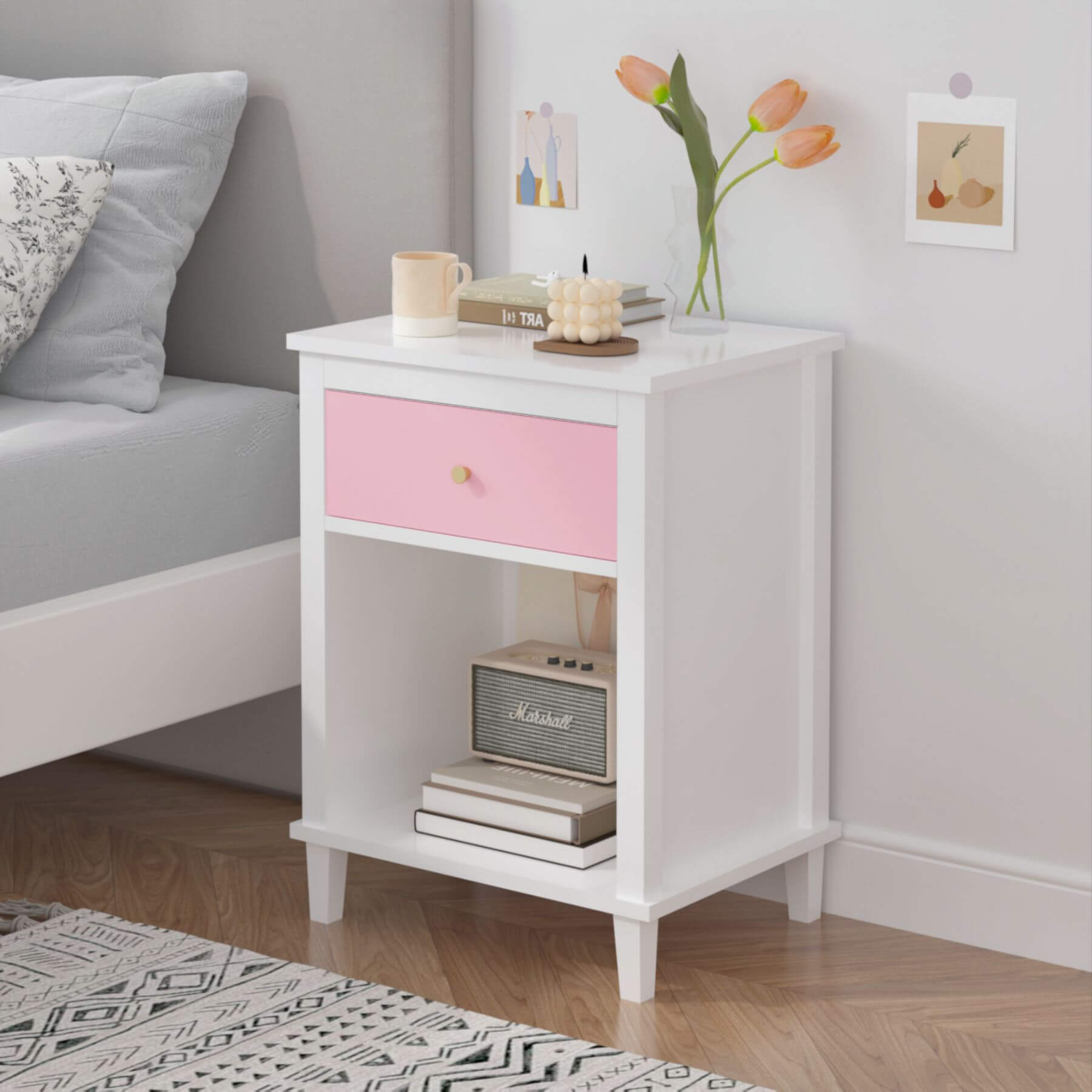 MOONRIVER Golden Handle Wooden Nightstand - Pink next to a bed in a bedroom setting.