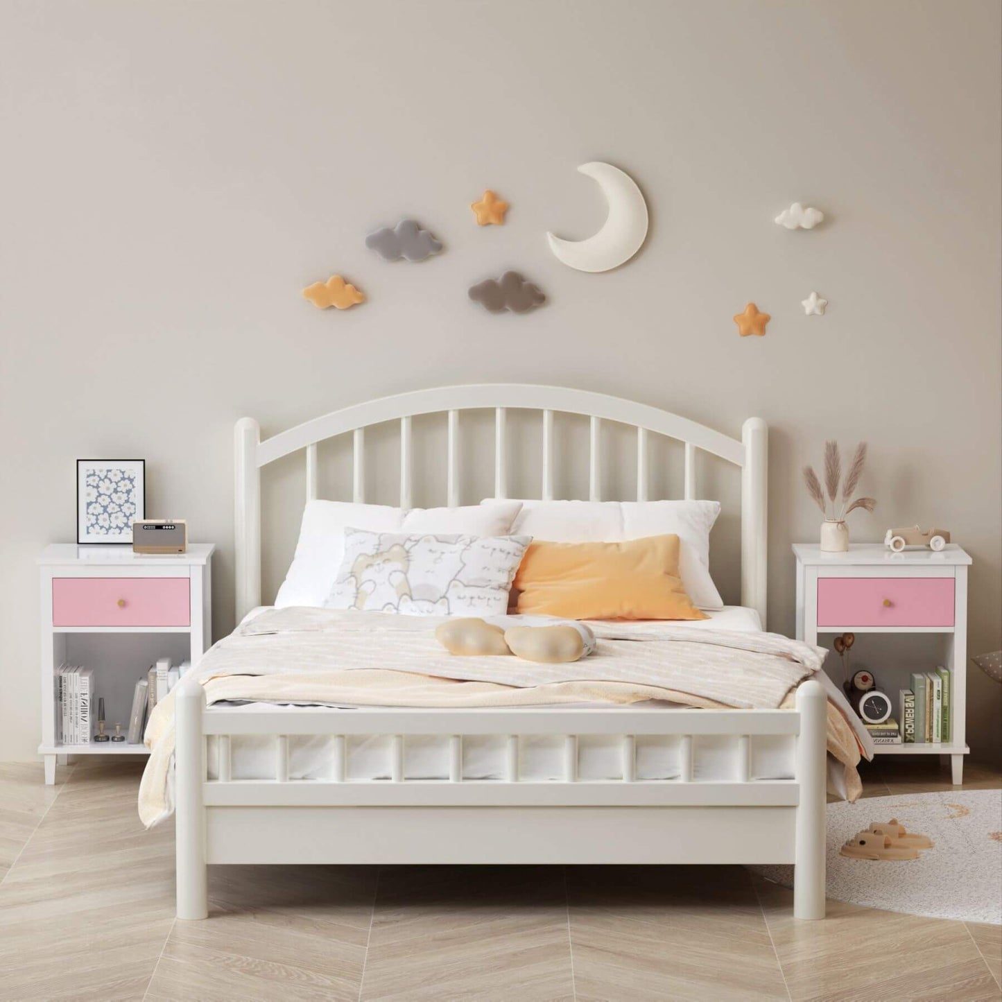 White bed in a child's bedroom with decorative wall stickers.