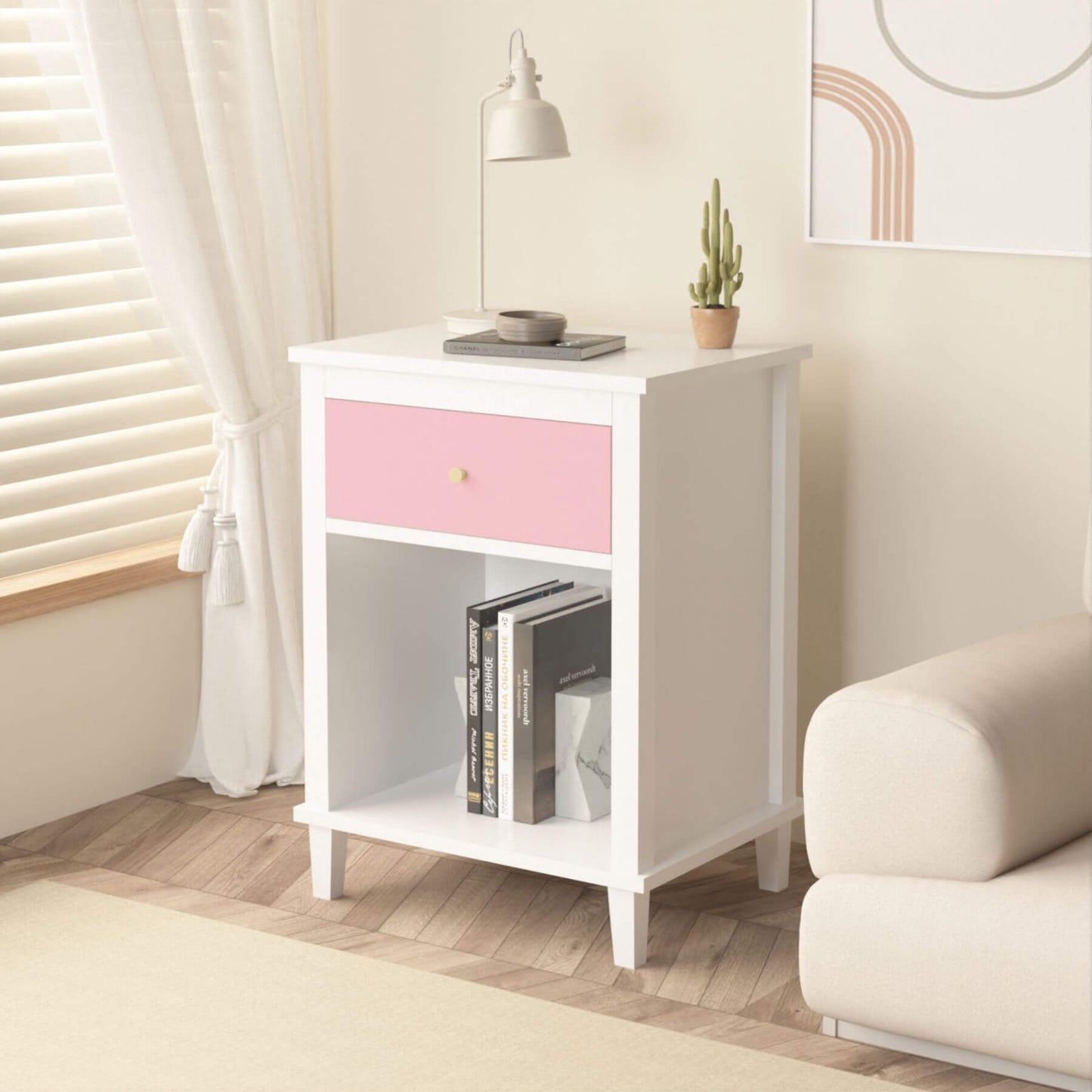MOONRIVER Golden Handle Wooden Nightstand - Pink in a room with a couch and lamp.