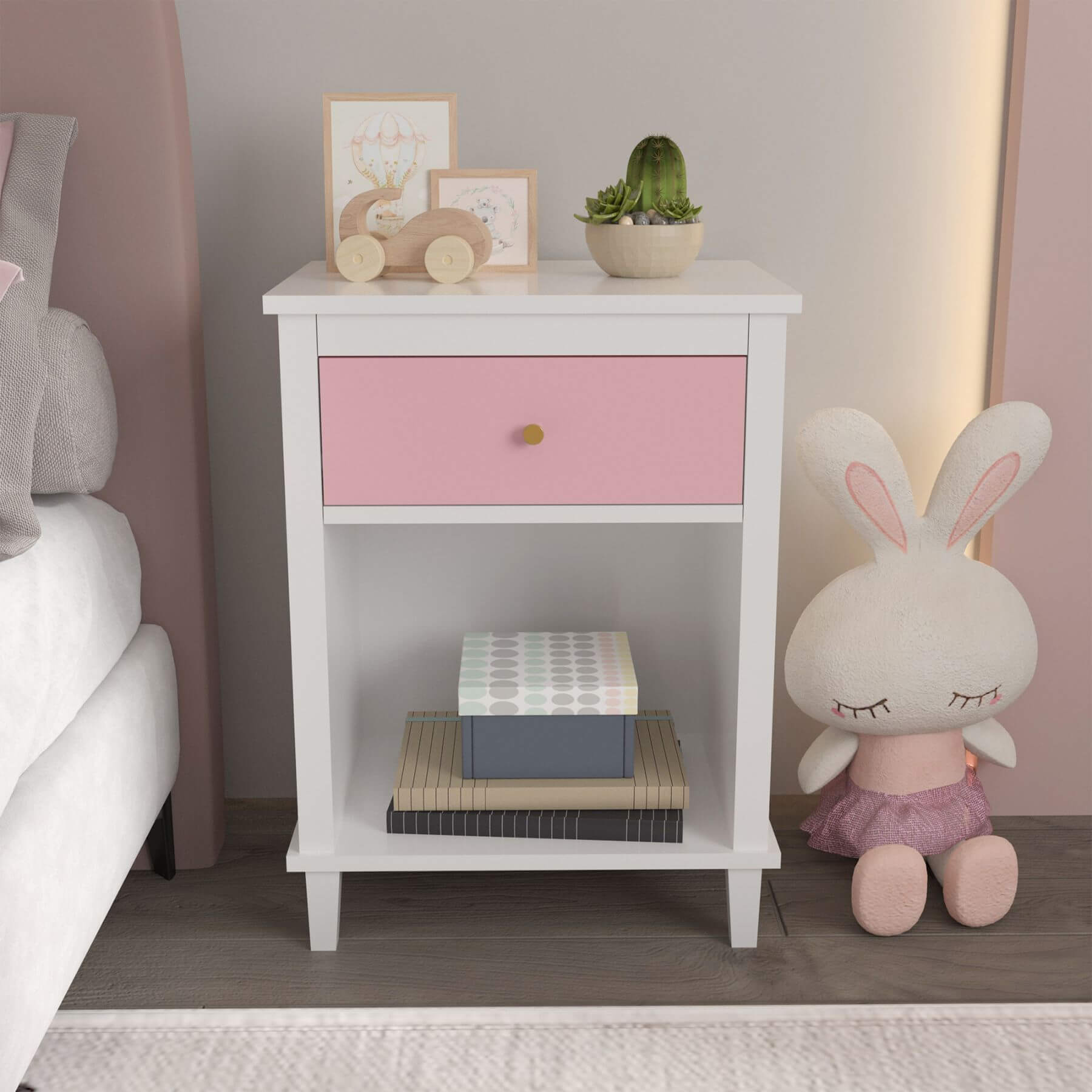 MOONRIVER Golden Handle Wooden Nightstand - Pink next to a plush rabbit toy in a bedroom setting.