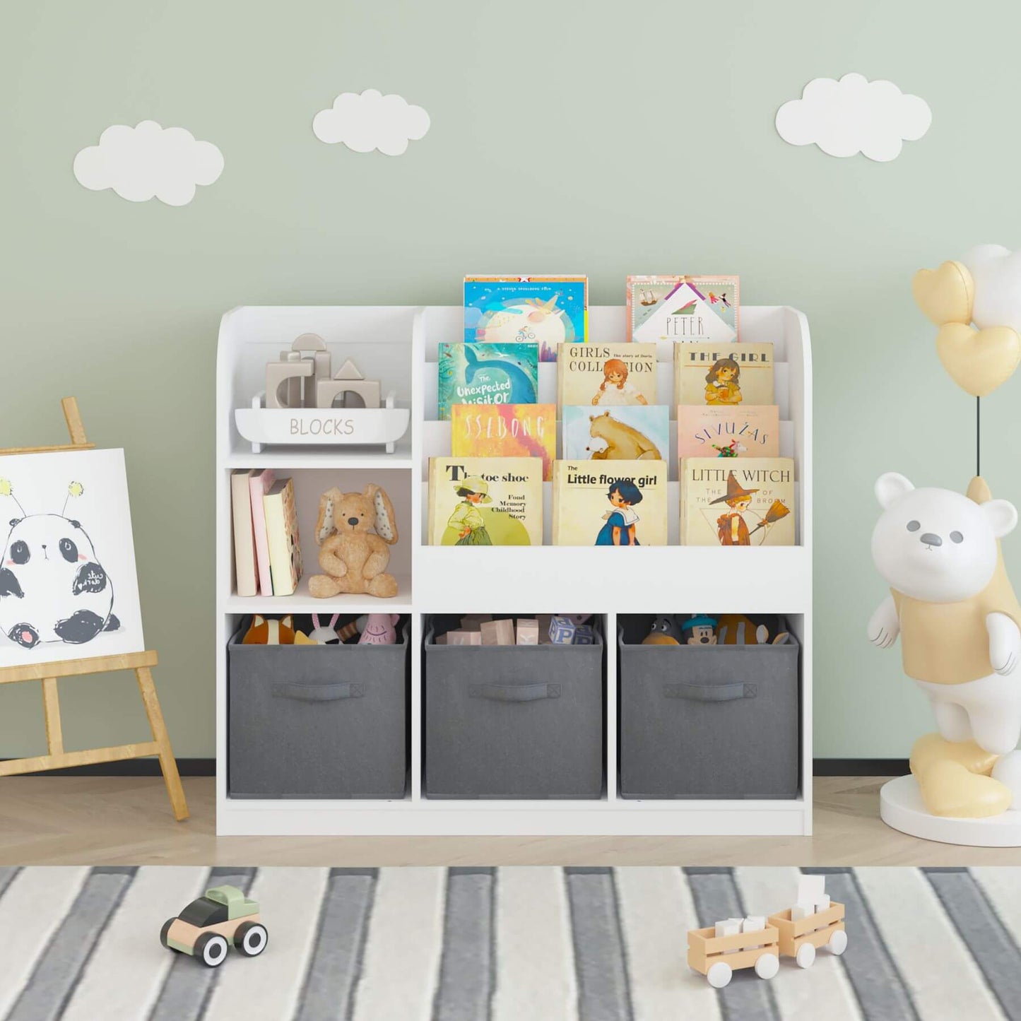 Children's room with MOONRIVER Kids Bookcase with 3 Collapsible Fabric Drawers - White/Gray, books, toys, and decorative elements.
