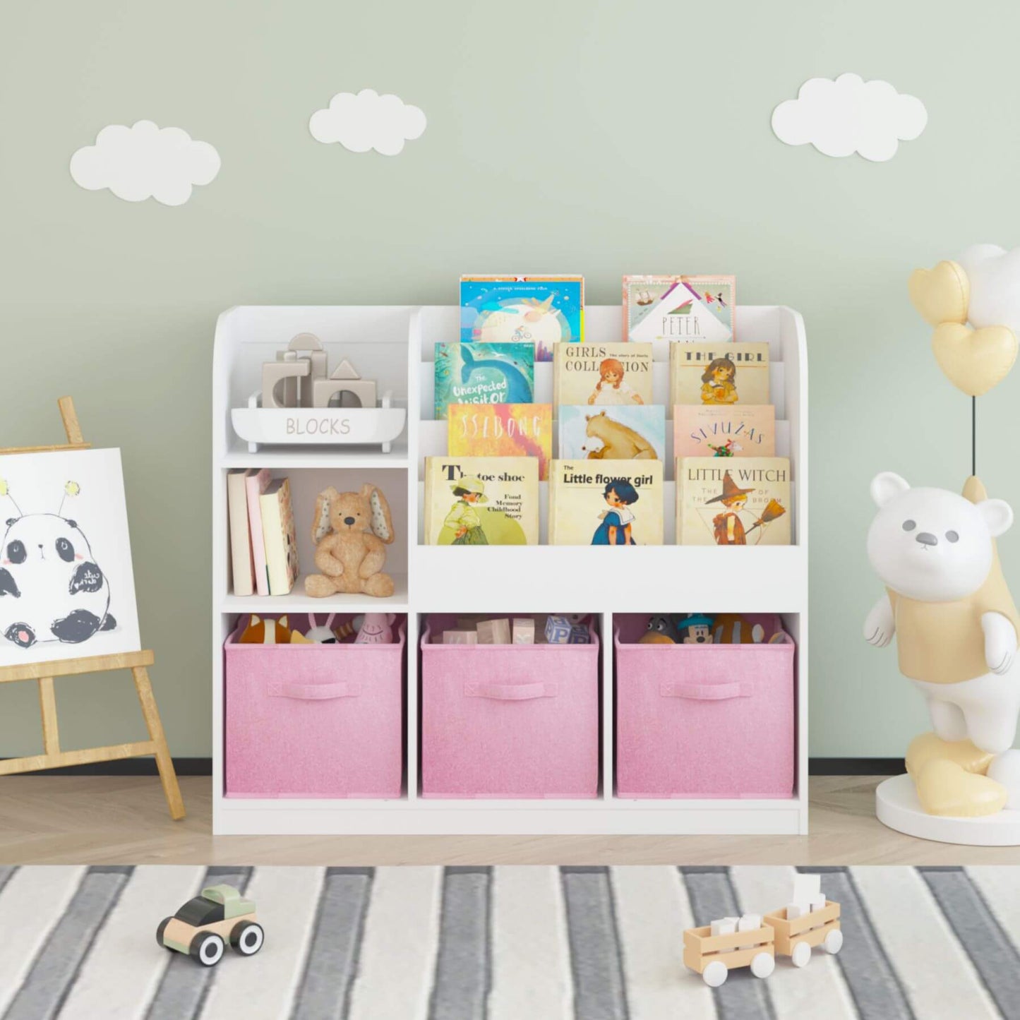 MOONRIVER Kids Bookcase with 3 Collapsible Fabric Drawers - White/Pink with books and toys against a light green wall.