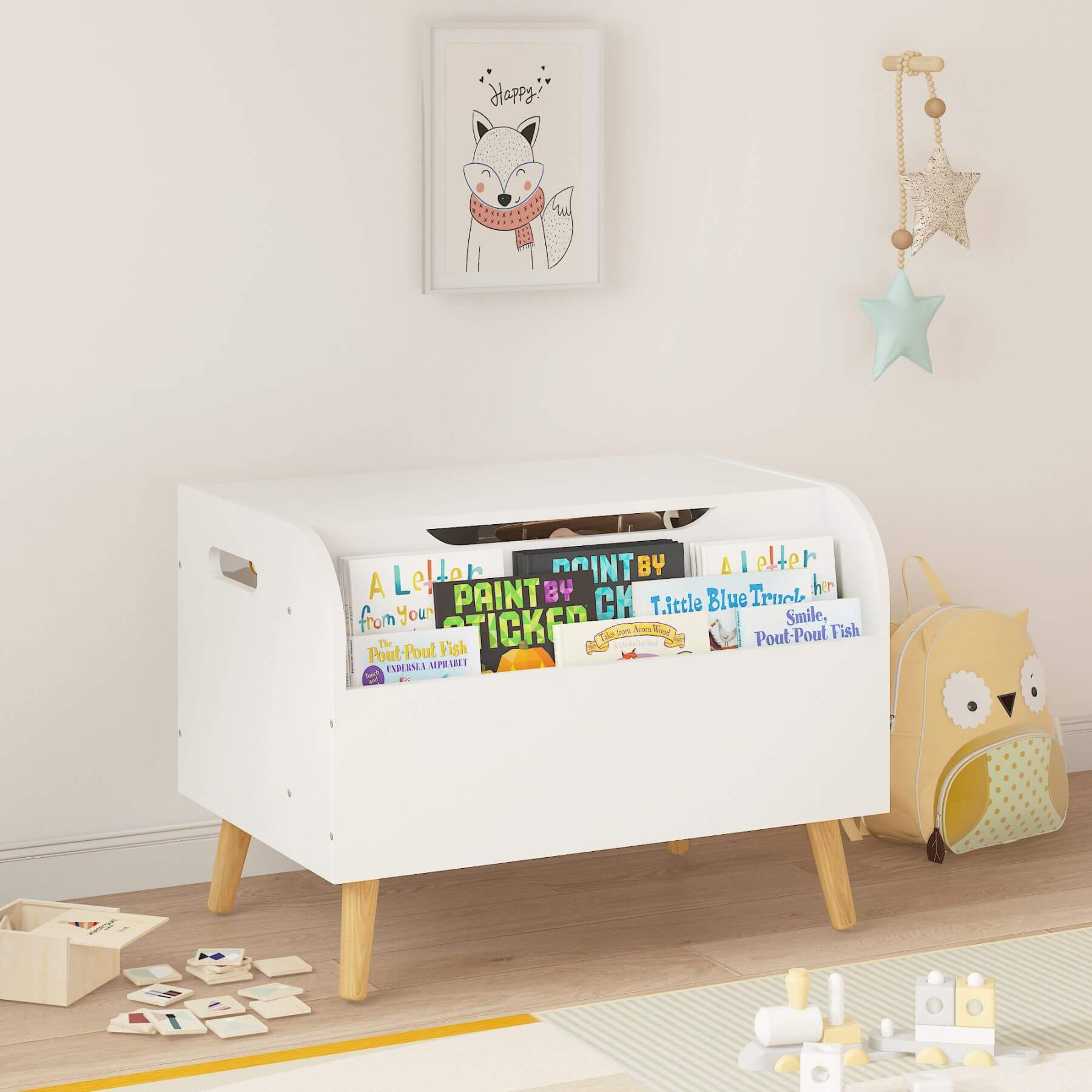 White toy storage box with books and toys in a child's room
