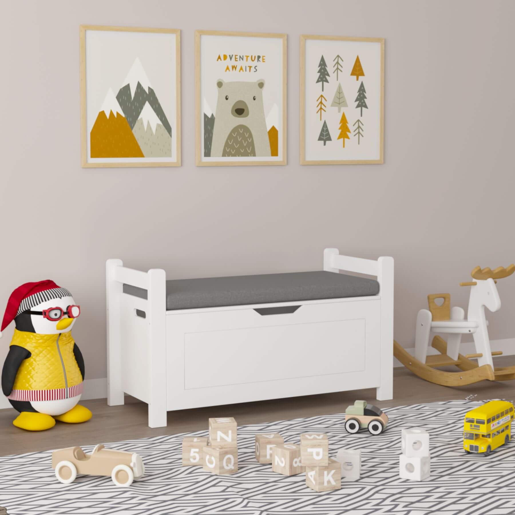 Children's room with MOONRIVER Kids Toy Box Chest, penguin toy, and wooden toys on a patterned rug.