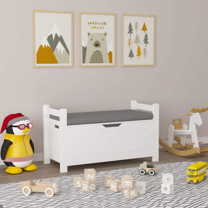 Children's room with MOONRIVER Kids Toy Box Chest, penguin toy, and wooden toys on a patterned rug.