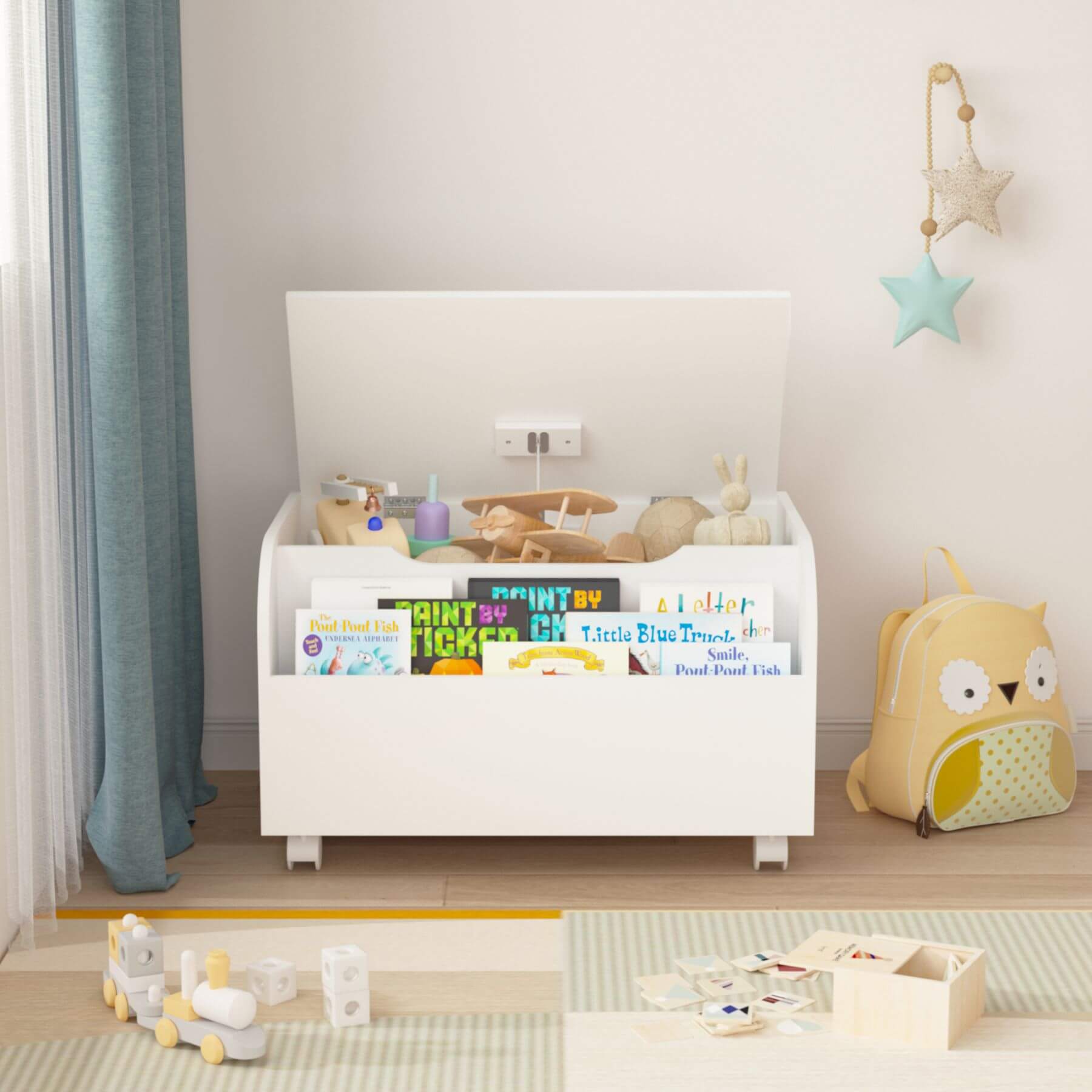 White toy storage box with books and toys in a child's room