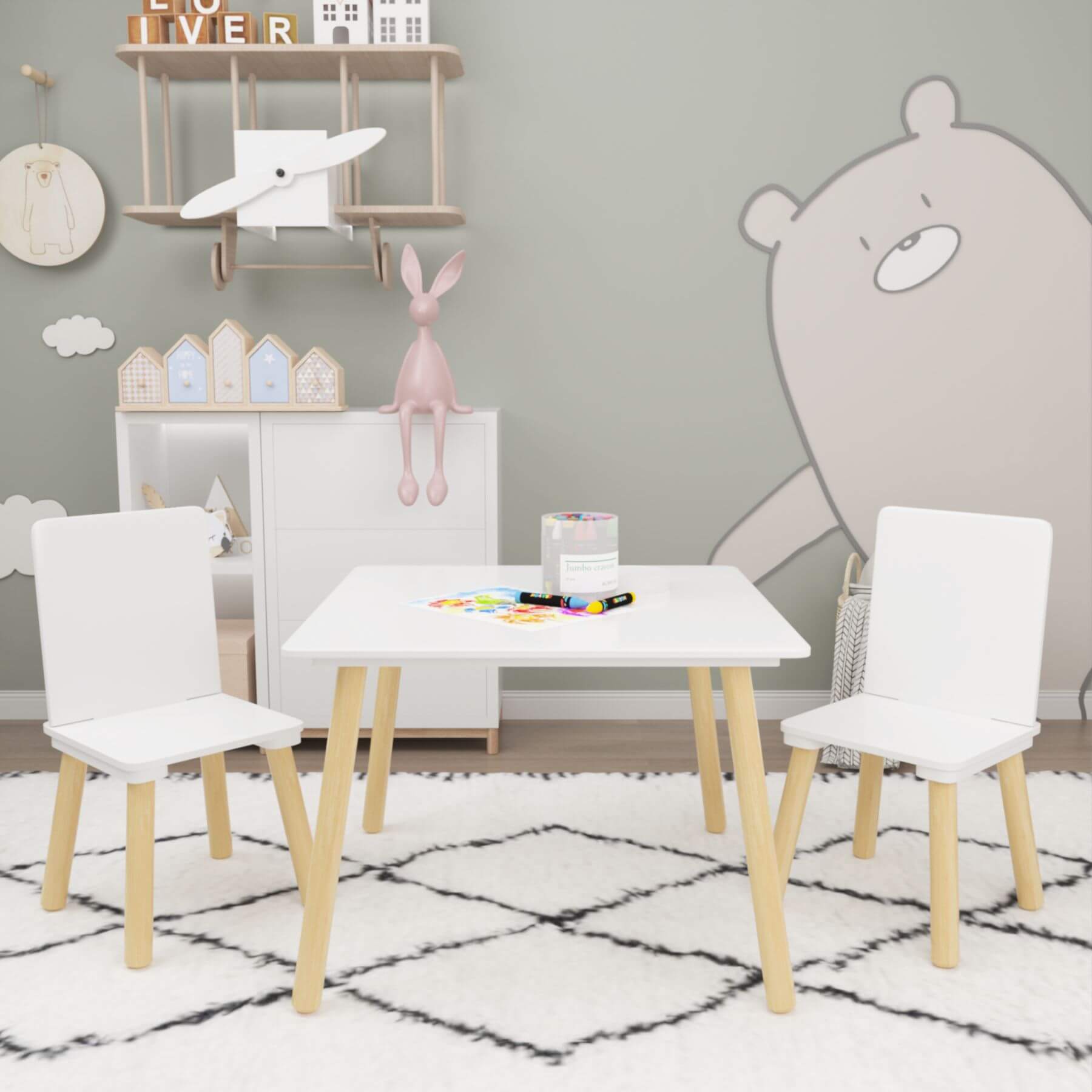 MOONRIVER Wooden Kids Table and 2 Chairs Set - White in a room with decorative elements and a bear mural.