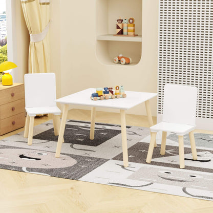 Children's play area with MOONRIVER Wooden Kids Table and 2 Chairs Set - White on a patterned rug.