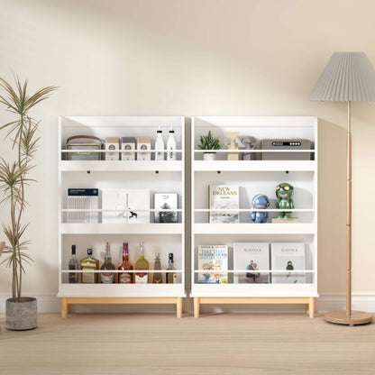 White bookshelf with various items in a room with a plant and lamp.