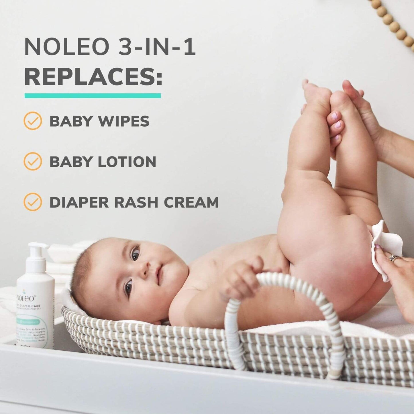 Baby lying on a changing table with Noleo 3-in-1 product, showing its uses.