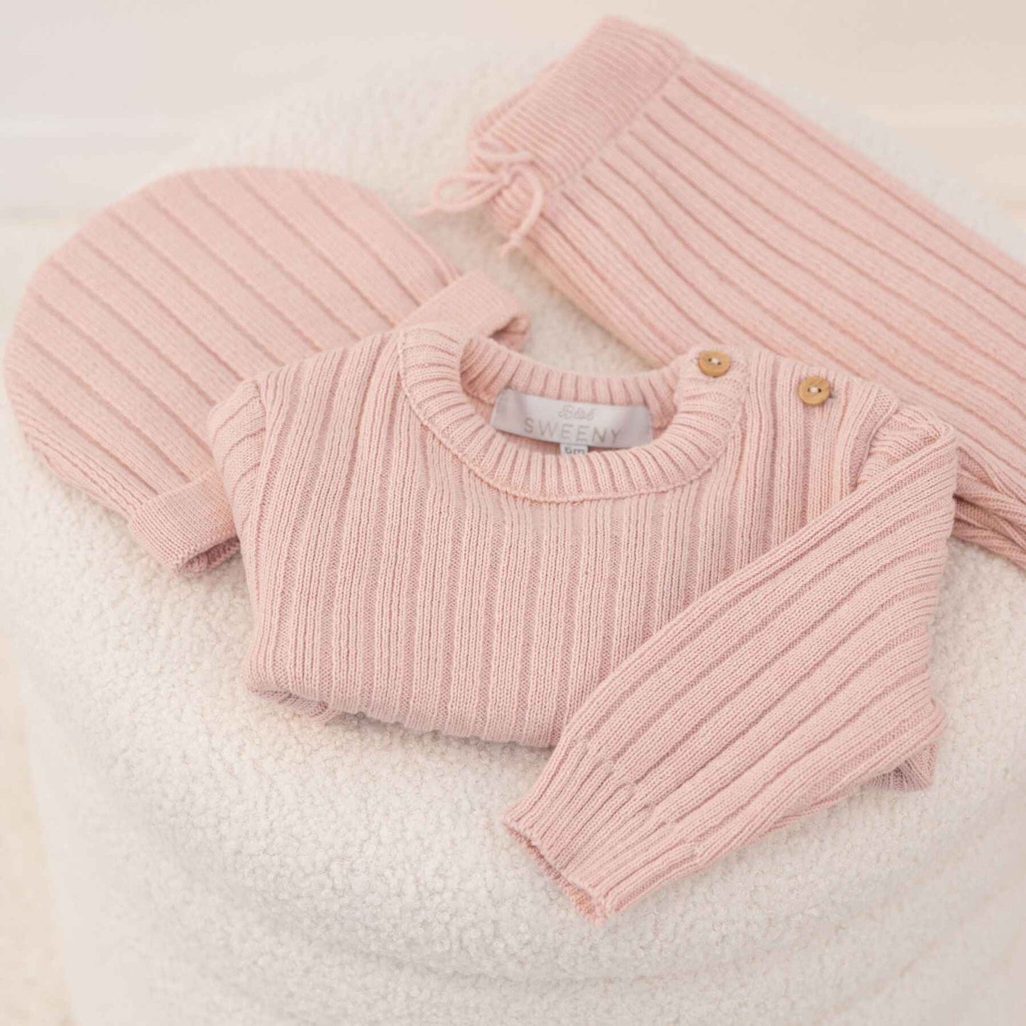 Bebe Sweeny REMY | Pink Ribbed Knit Leggings Set on a soft white background