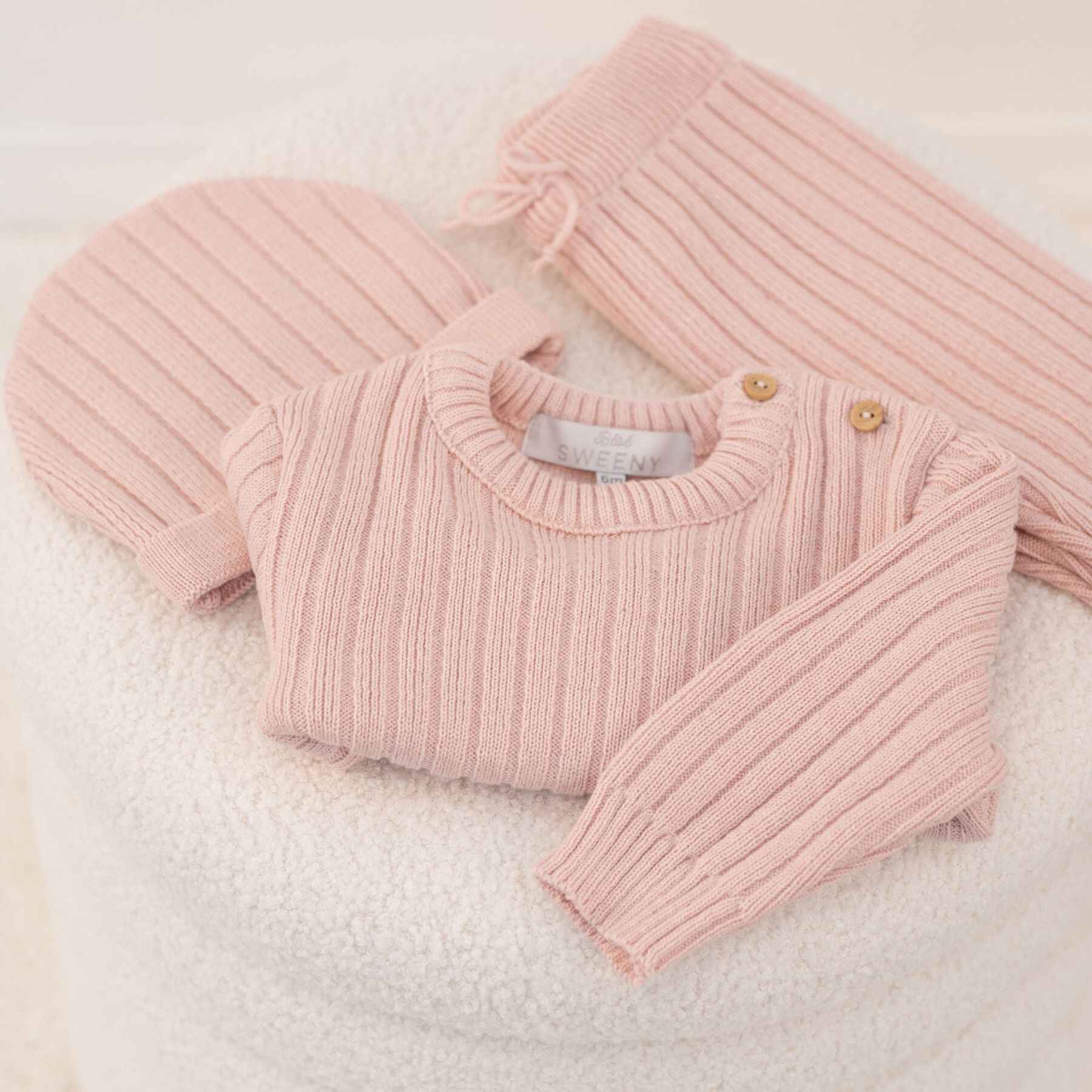 Bebe Sweeny REMY | Pink Ribbed Knit Leggings Set on a soft white background