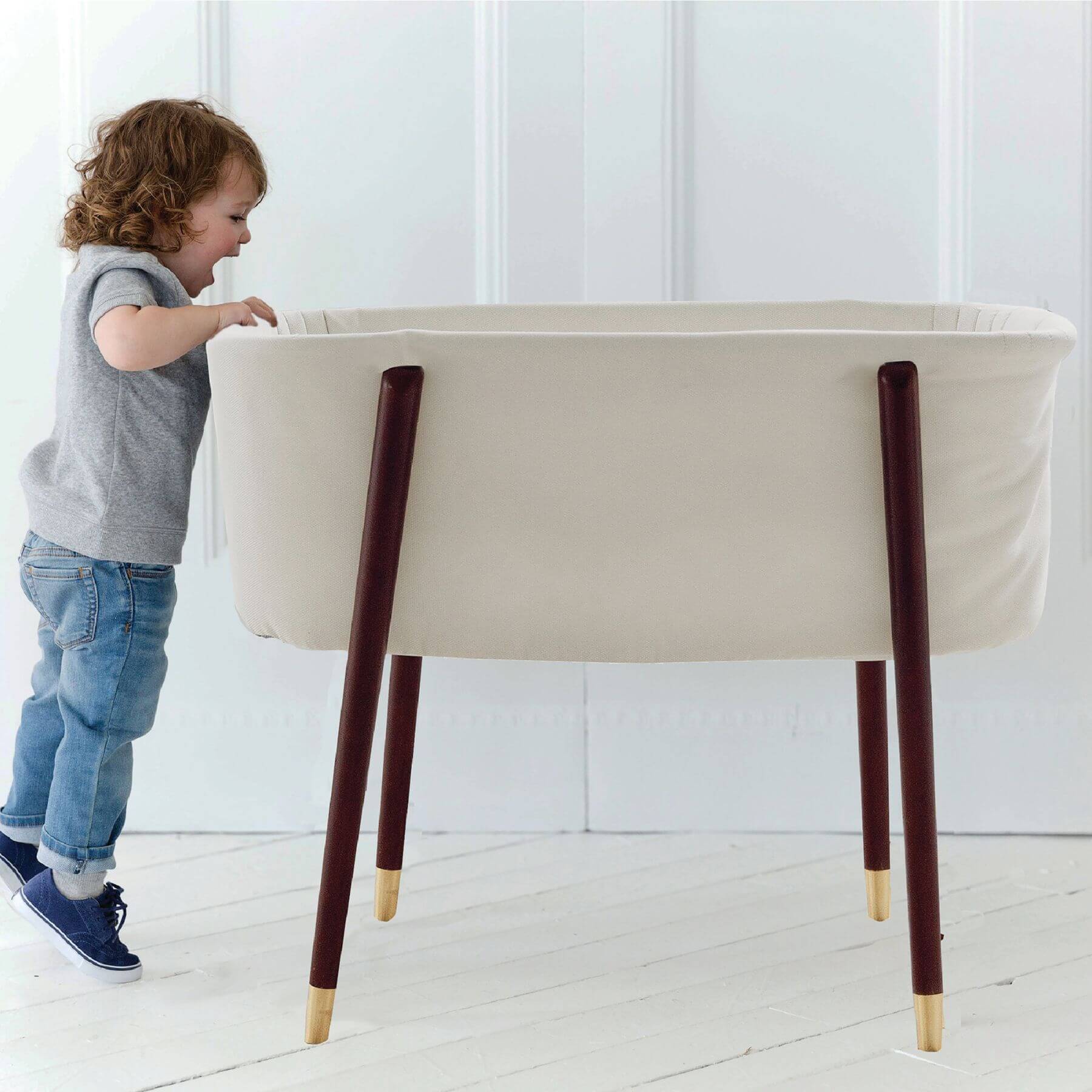 Kid Looking into TruBliss SOVA Bassinet Irish Cream