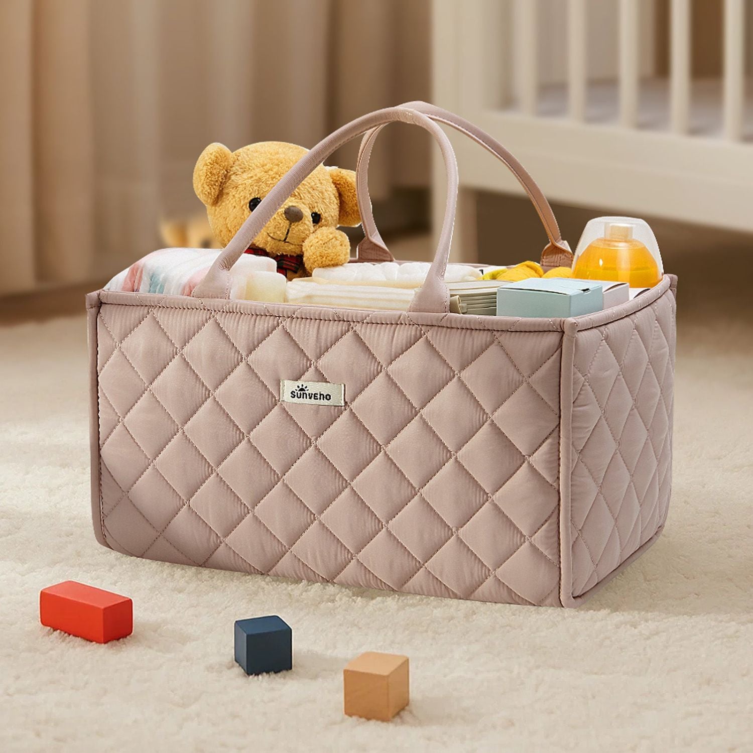 Sunveno Quilted Diaper Caddy Organizer - Brown with teddy bear and toys on a carpeted floor