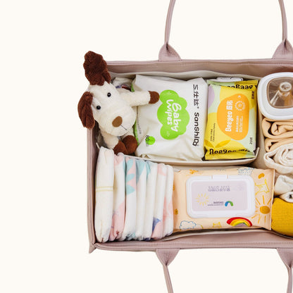 Sunveno Quilted Diaper Caddy Organizer - Brown with diapers, wipes, and a plush toy on a white background