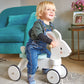 Child riding Tender Leaf Running Rabbit Ride Onin a living room.