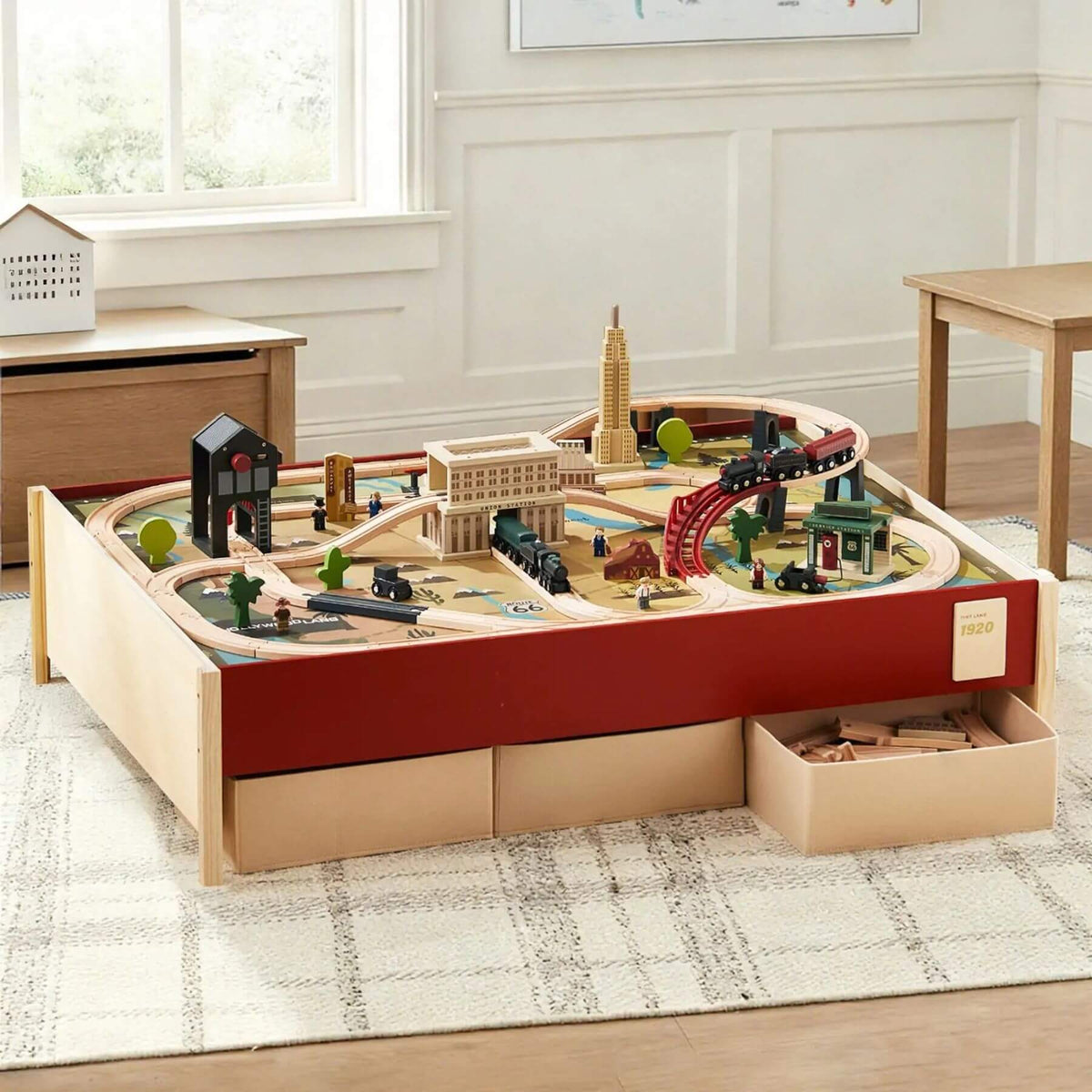 Tiny Land® 1920 Railway Adventure Train Table on a rug.
