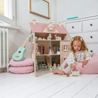 Child playing with Tender Leaf Alouette House in a bright room