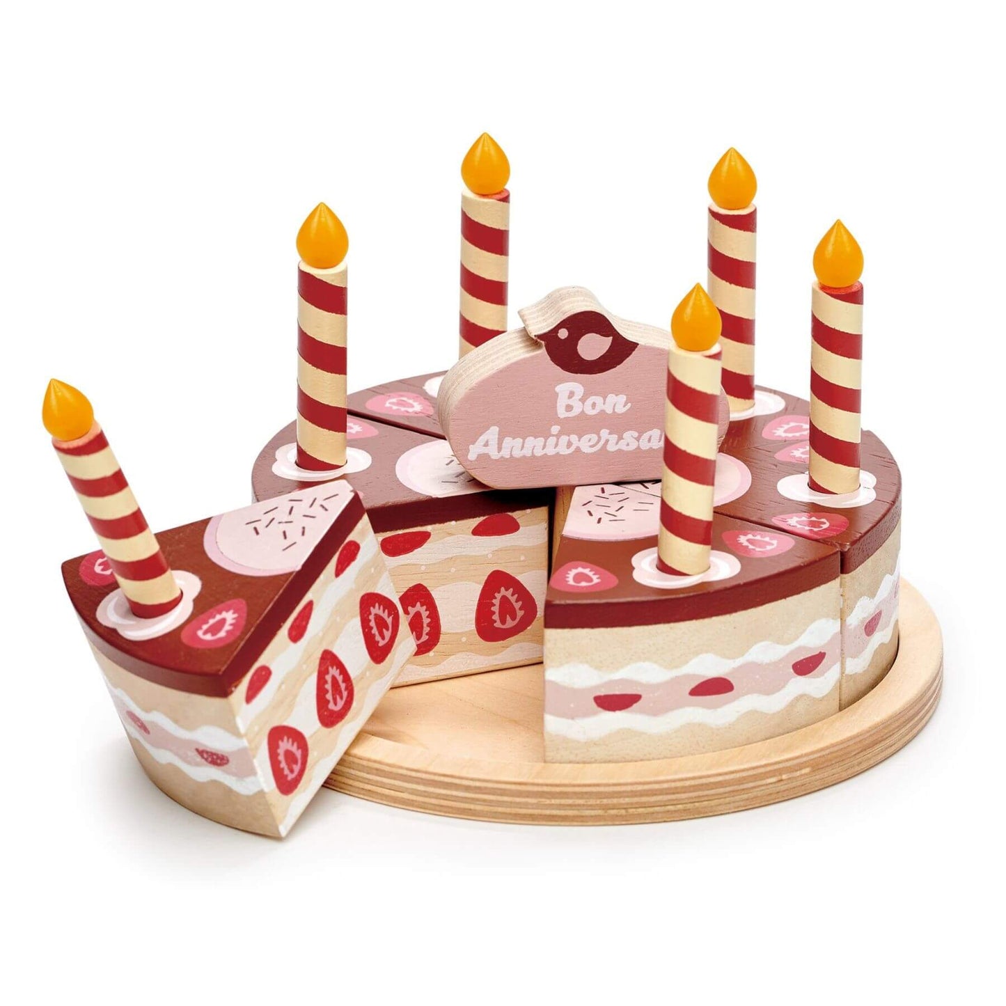 Wooden birthday cake toy with candles and 'Bon Anniversaire' sign on a white background