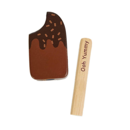 Chocolate-themed spatula and wooden handle with 'Ooh Yummy' text on a white background
