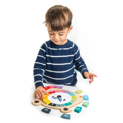 Child playing with a colorful wooden educational toy on a white background