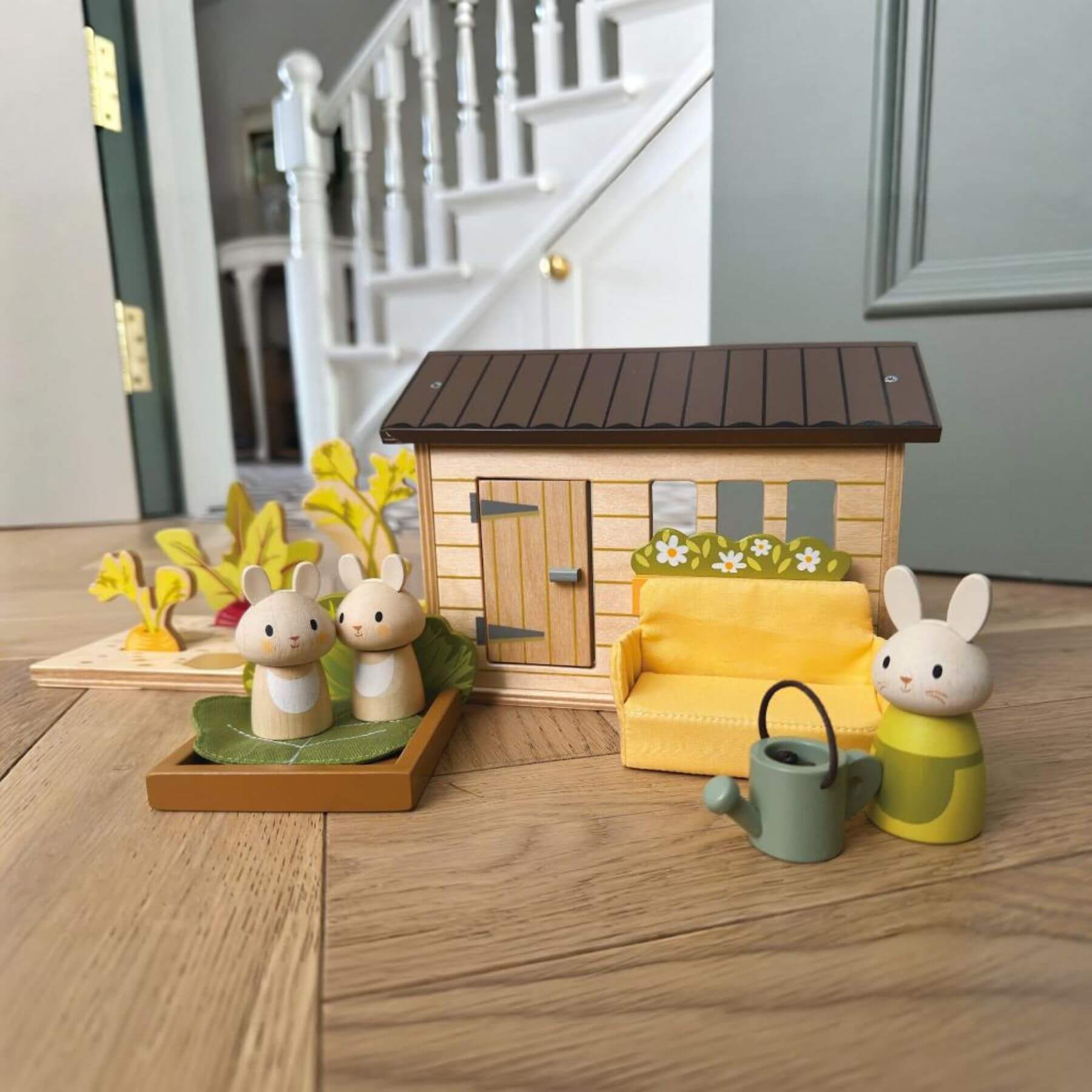 Tender Leaf Bunny's Carrot Patch on a wooden floor.