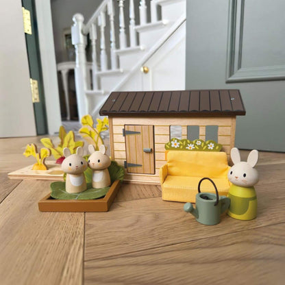 Tender Leaf Bunny's Carrot Patch on a wooden floor.