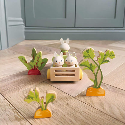 Tender Leaf Bunny's Carrot Patch on a wooden floor