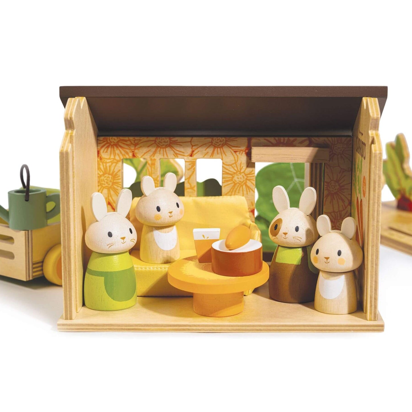 Wooden toy set with rabbit figures and a house-like structure on a white background