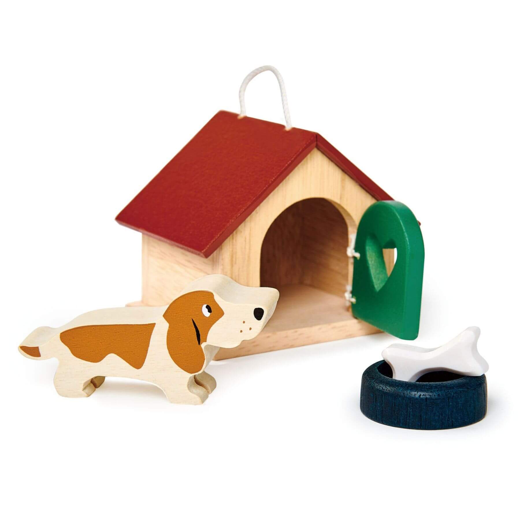 Wooden doghouse with a dog and tire toy on a white background