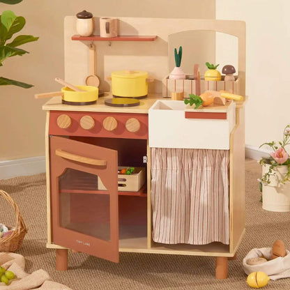 Tiny Land® Cubby Kitchenette - Natural on a wooden floor.