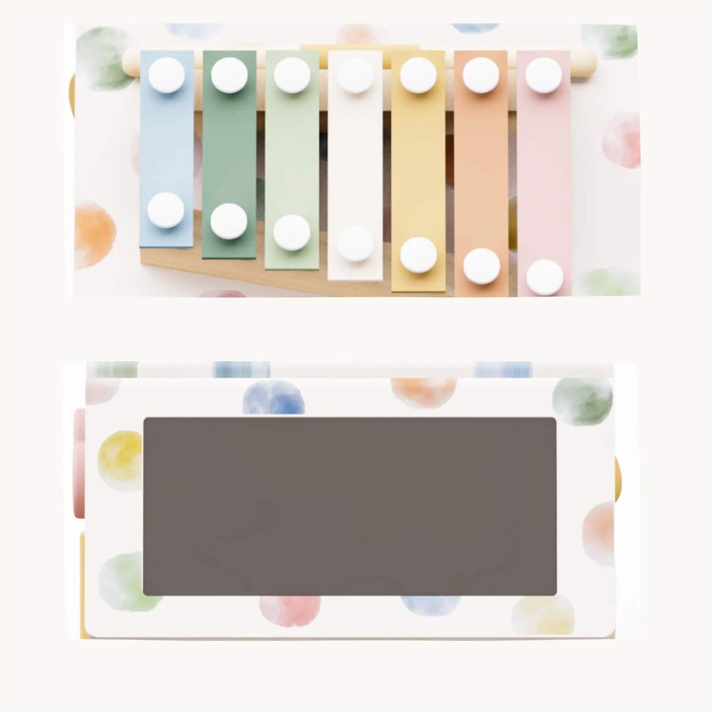 Pastel-colored xylophone with a gray rectangular object on a white background