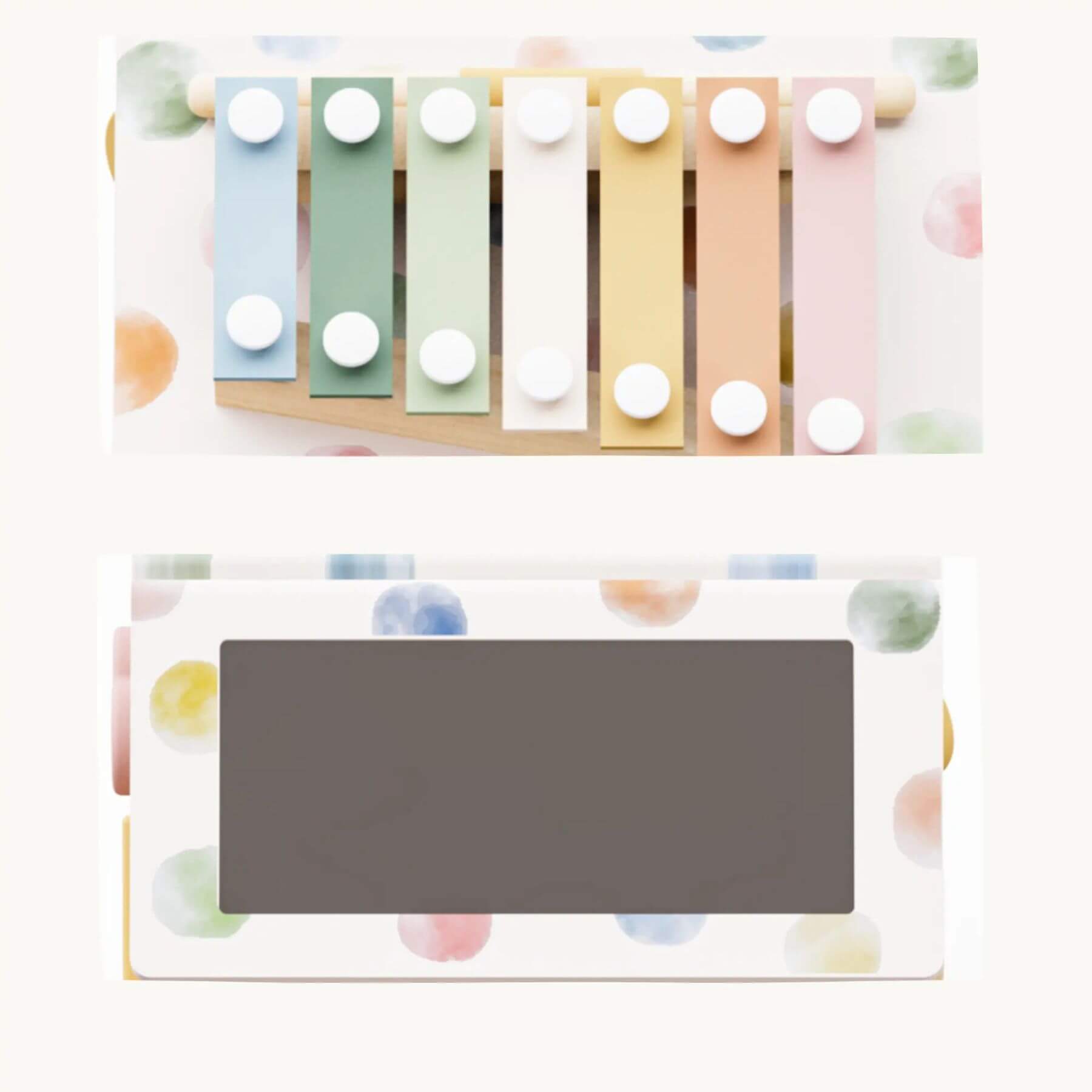 Pastel-colored xylophone with a gray rectangular object on a white background