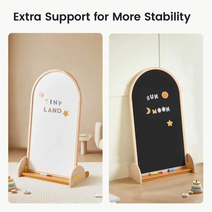 Two children's easels, one white and one black, with 'Tiny Land' and celestial designs on a neutral background.