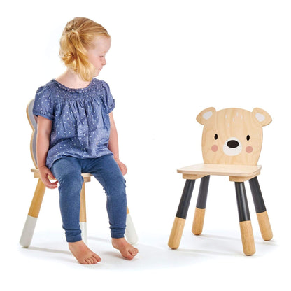 Child sitting on Tender Leaf Forest Bear Chair next to another Tender Leaf Forest Bear Chair